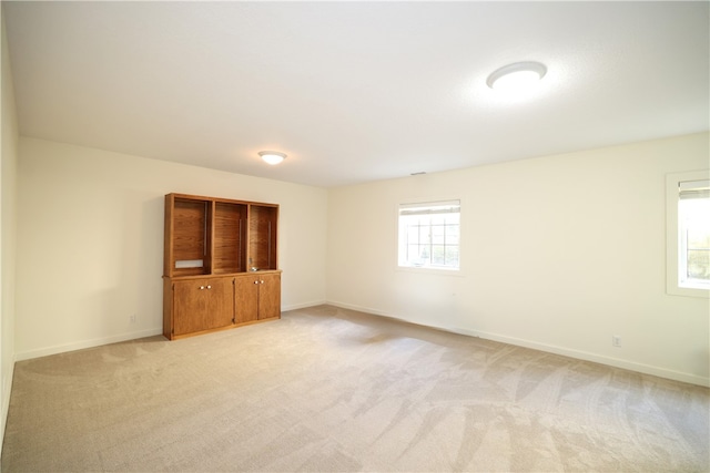 unfurnished bedroom featuring light colored carpet