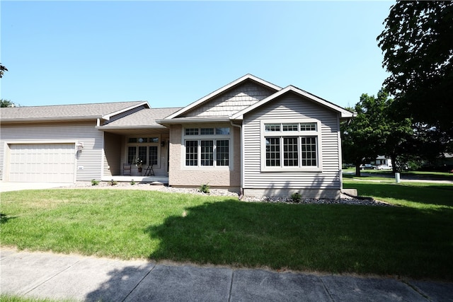 single story home featuring a front yard and a garage