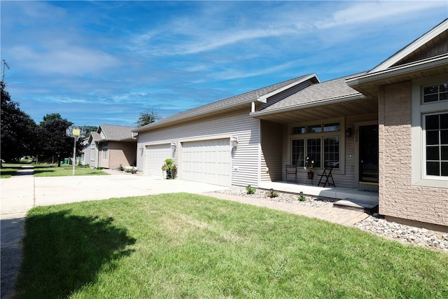 exterior space with a garage and a yard