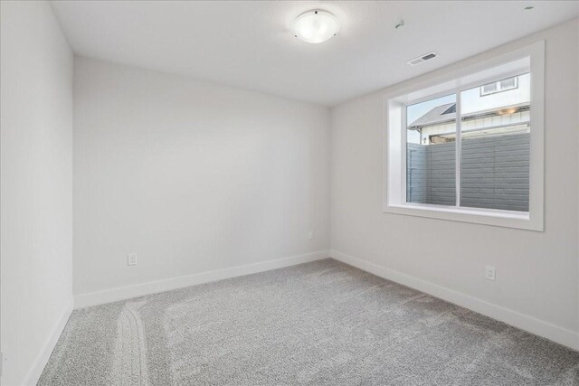 view of carpeted spare room