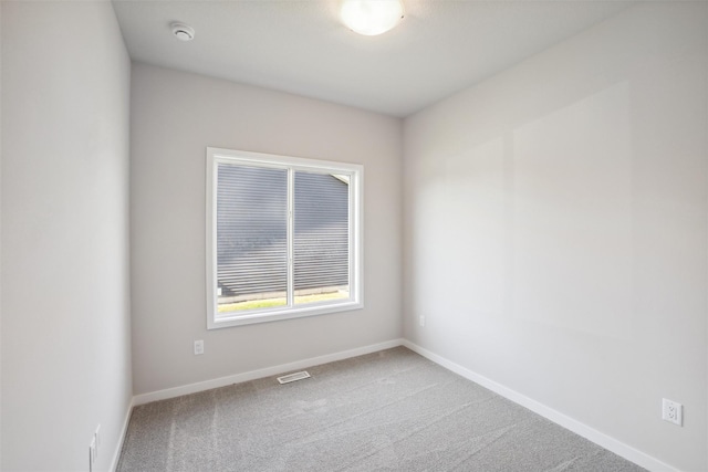 unfurnished room with carpet floors