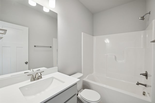 full bathroom with vanity,  shower combination, and toilet