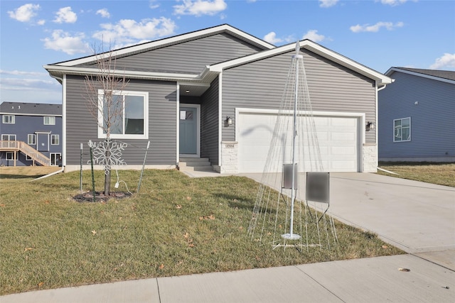 view of front facade with a garage and a front lawn