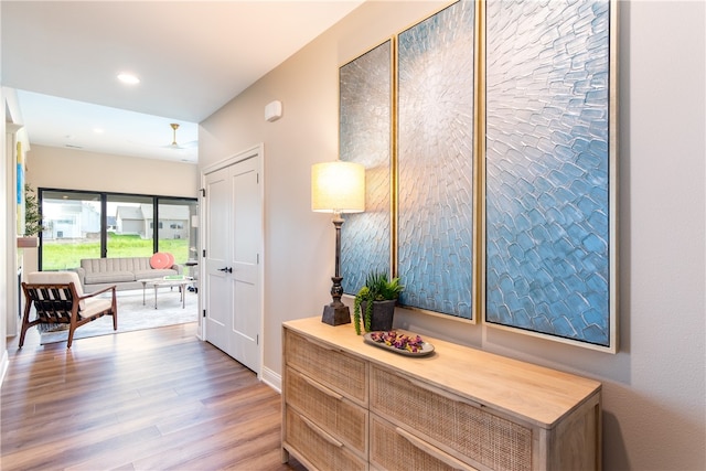 hall with hardwood / wood-style floors