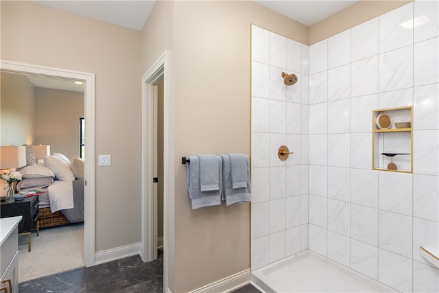 bathroom with tile patterned flooring and tiled shower