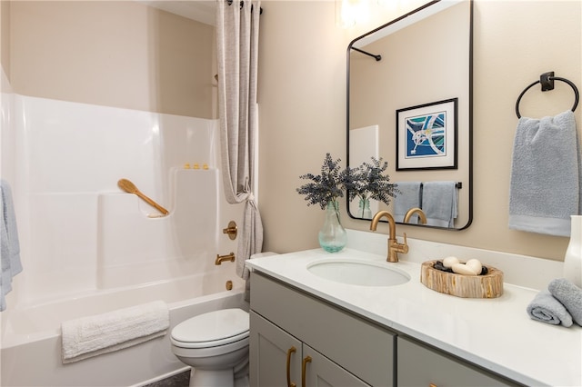 full bathroom with shower / bath combo, toilet, and vanity