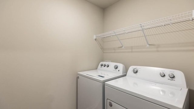 laundry room with washer and dryer and laundry area