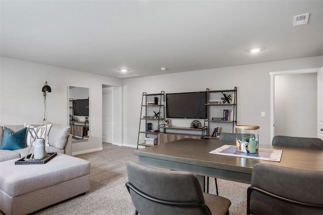 living area featuring carpet floors, recessed lighting, visible vents, and baseboards