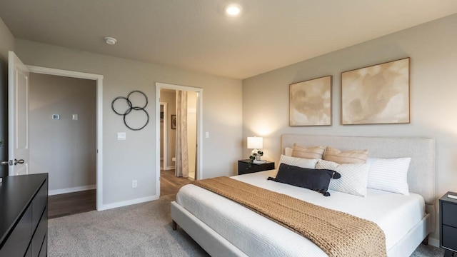 bedroom featuring carpet floors and baseboards