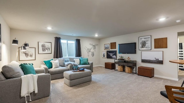 living area featuring carpet, baseboards, and recessed lighting