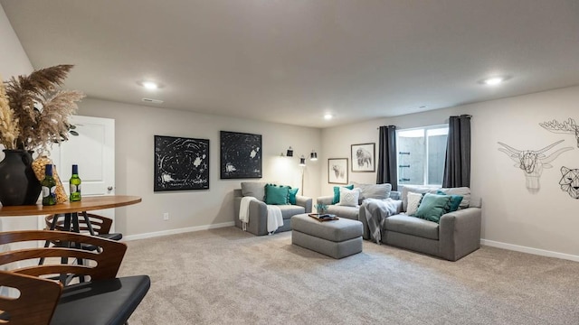 living area featuring recessed lighting, light colored carpet, and baseboards