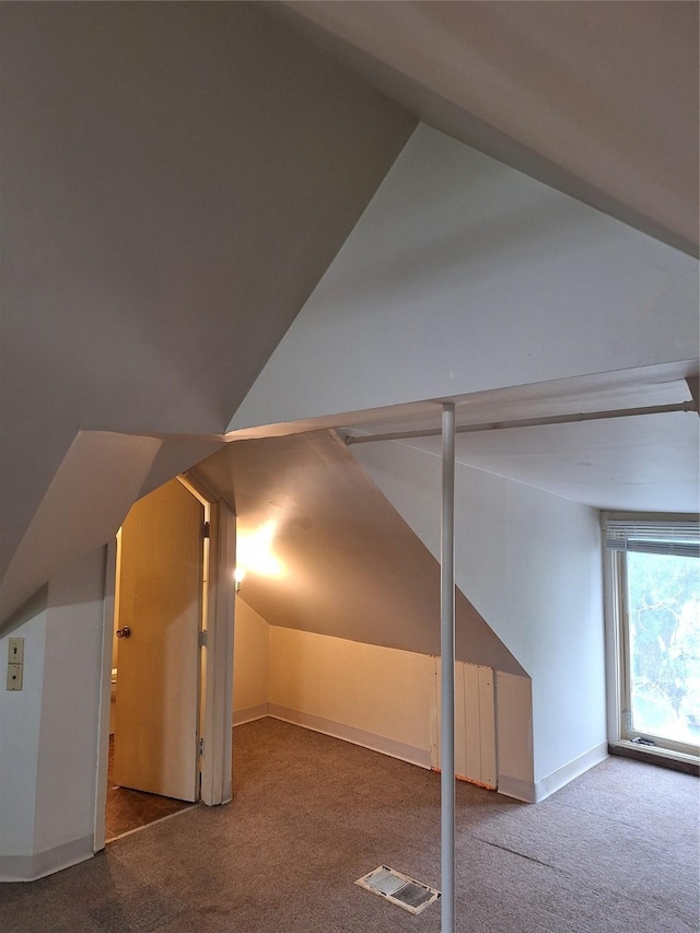 317 7th St, West Des Moines, IA 50265 - additional living space featuring carpet floors, vaulted ceiling, and baseboards