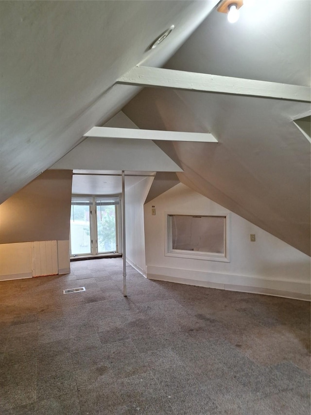 317 7th St, West Des Moines, IA 50265 - additional living space featuring lofted ceiling, carpet, and baseboards