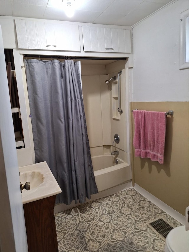 317 7th St, West Des Moines, IA 50265 - bathroom with shower / bath combination with curtain, vanity, tile patterned flooring, and toilet