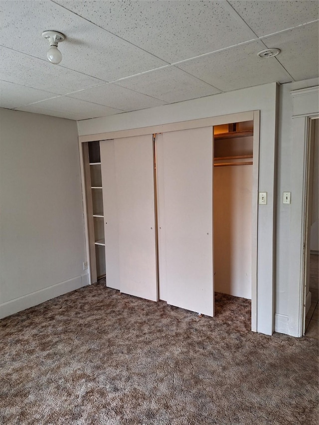 317 7th St, West Des Moines, IA 50265 - unfurnished bedroom with carpet, a closet, and a paneled ceiling