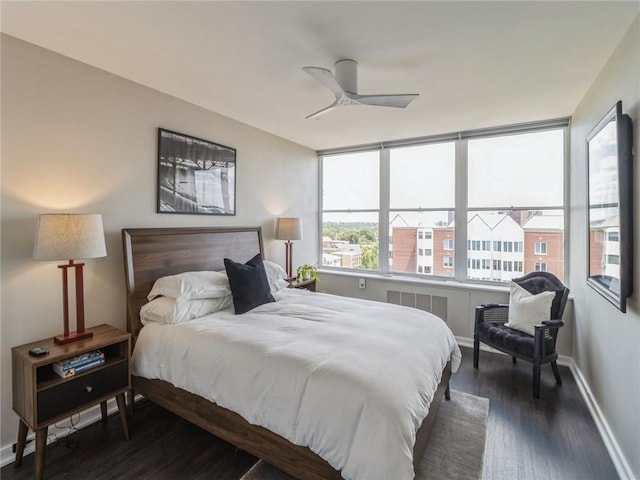 bedroom featuring ceiling fan and dark hardwood / wood-style floors