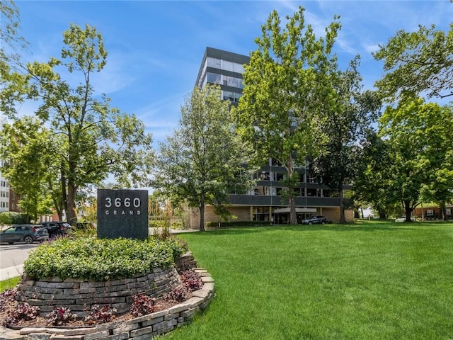 view of home's community with a lawn