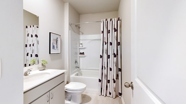 bathroom with vanity, toilet, and shower / bathtub combination with curtain