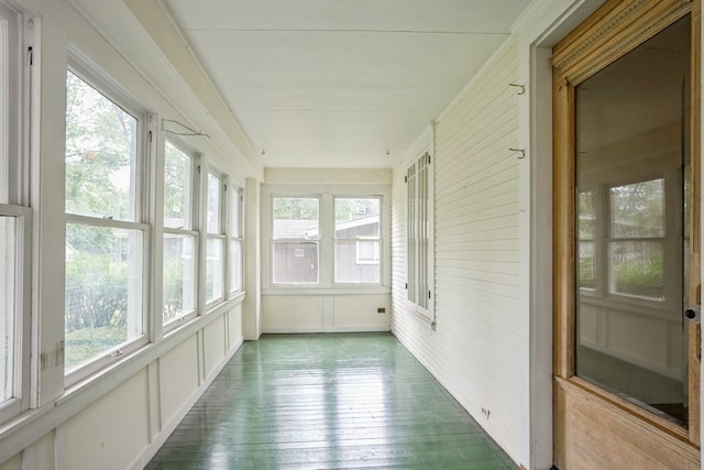 unfurnished sunroom with a wealth of natural light