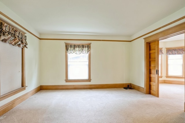 empty room featuring light colored carpet