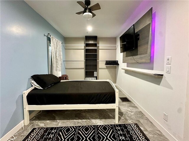 tiled bedroom with ceiling fan