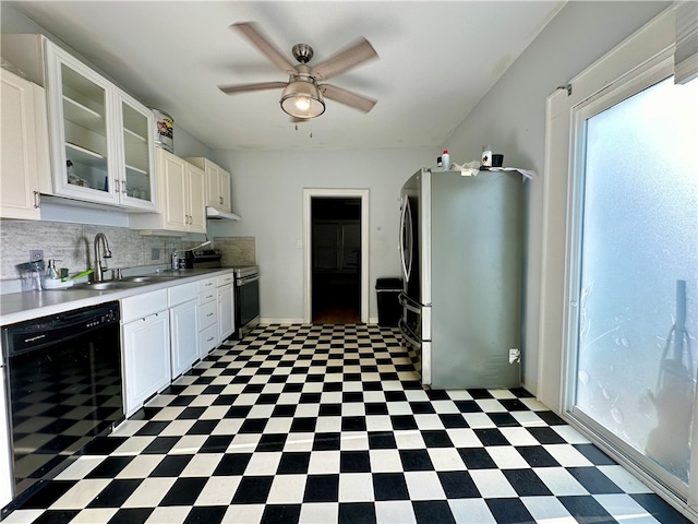 kitchen with ceiling fan, decorative backsplash, white cabinetry, appliances with stainless steel finishes, and dark tile patterned floors