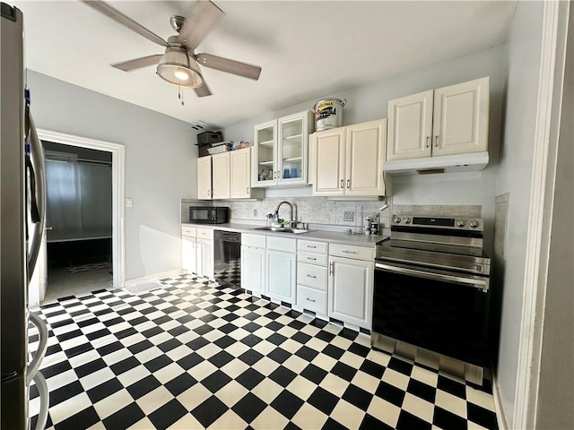 kitchen featuring sink, black appliances, backsplash, and light tile patterned floors