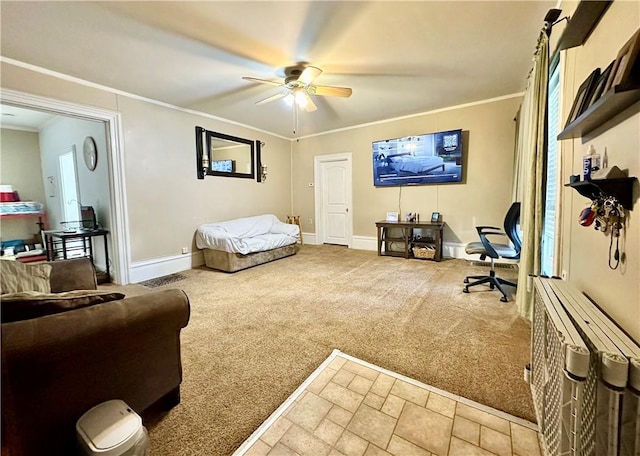 carpeted living room with ceiling fan and ornamental molding