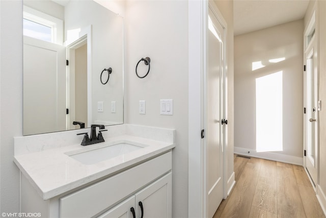 bathroom featuring hardwood / wood-style floors and vanity