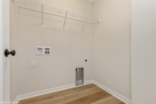 laundry area with hookup for an electric dryer, washer hookup, and hardwood / wood-style flooring