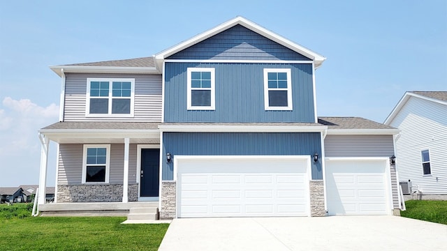 1104 Westridge St SW, Bondurant, IA 50035 - craftsman-style home featuring driveway, stone siding, a shingled roof, covered porch, and a front yard