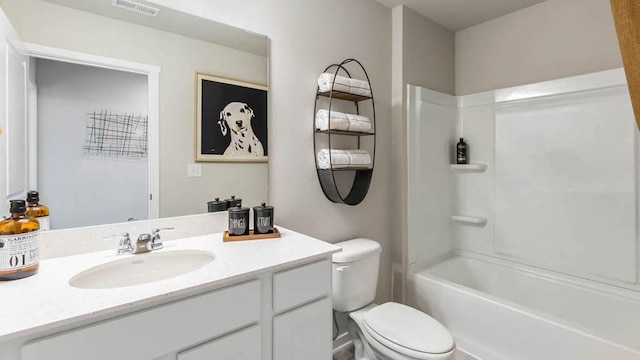 bathroom with toilet, bathtub / shower combination, vanity, and visible vents