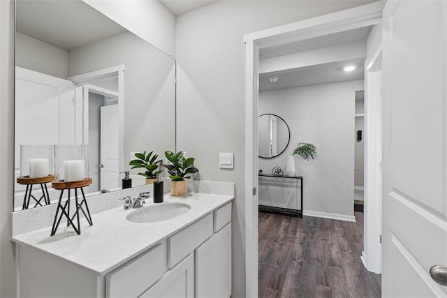 bathroom with vanity and hardwood / wood-style floors