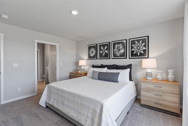 bedroom featuring light carpet and baseboards