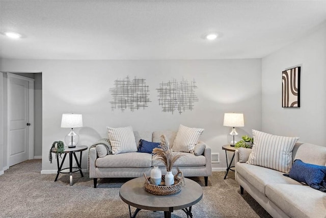 carpeted living area with recessed lighting and baseboards