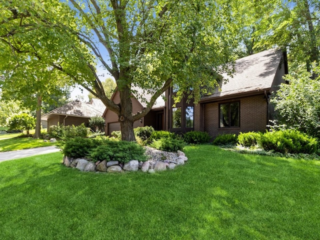 view of front of property with a garage and a front yard