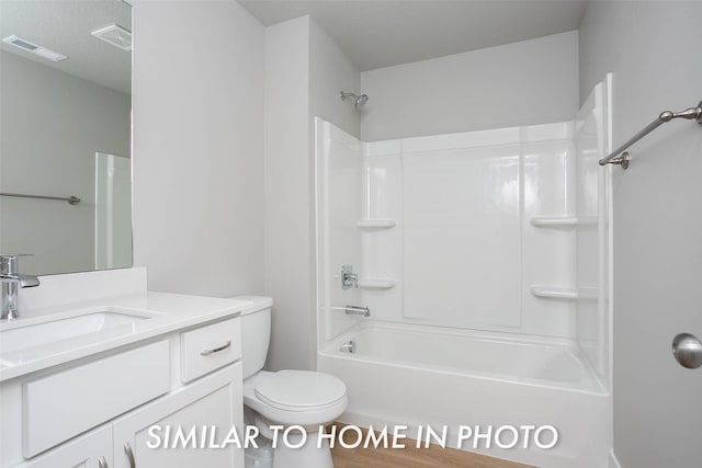 bathroom with shower / bathtub combination, visible vents, toilet, and vanity