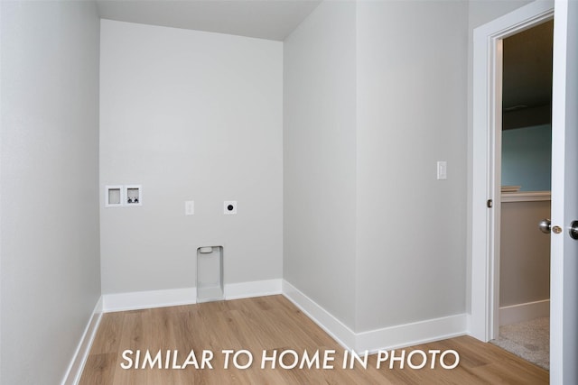 clothes washing area featuring laundry area, wood finished floors, hookup for a washing machine, baseboards, and electric dryer hookup