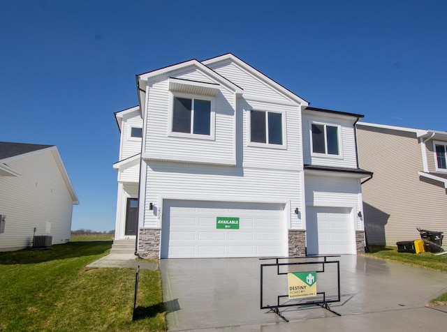 view of front of house with an attached garage, stone siding, central AC, and driveway