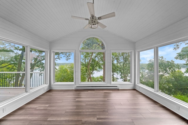 unfurnished sunroom featuring ceiling fan, lofted ceiling, a baseboard heating unit, and a healthy amount of sunlight