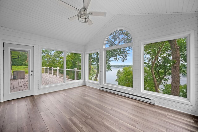 unfurnished sunroom with ceiling fan, a baseboard heating unit, and vaulted ceiling