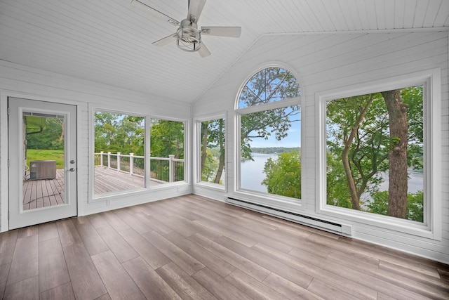 unfurnished sunroom featuring vaulted ceiling, baseboard heating, a water view, and a wealth of natural light