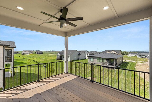 1185 NW 28th St, Grimes, IA 50111 - wooden terrace featuring a residential view, ceiling fan, and a yard