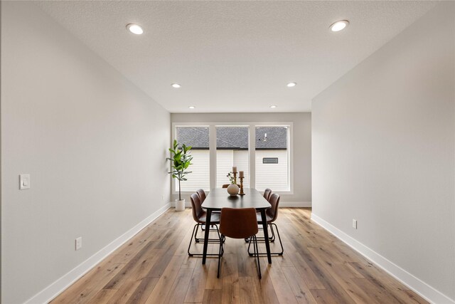1185 NW 28th St, Grimes, IA 50111 - dining room featuring light wood-style floors, baseboards, and recessed lighting
