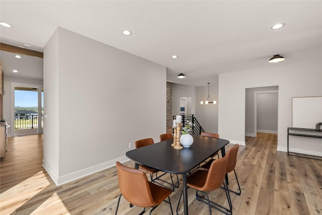 dining area with light wood-style floors, baseboards, a chandelier, and recessed lighting