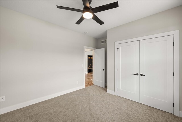 1185 NW 28th St, Grimes, IA 50111 - unfurnished bedroom featuring carpet flooring, baseboards, a closet, and ceiling fan