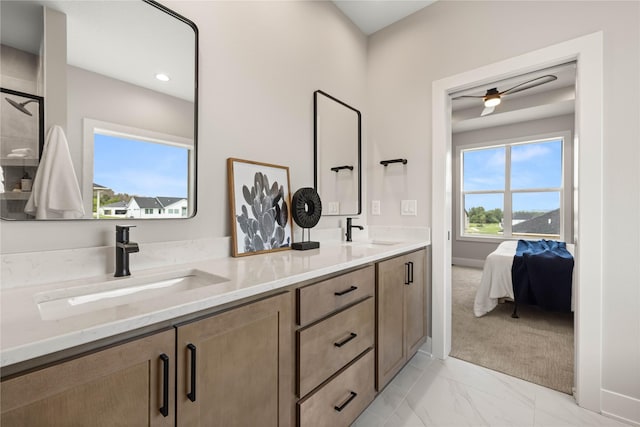 1185 NW 28th St, Grimes, IA 50111 - bathroom with a ceiling fan, double vanity, and marble finish flooring