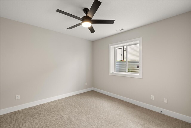 1185 NW 28th St, Grimes, IA 50111 - carpeted spare room featuring ceiling fan and baseboards