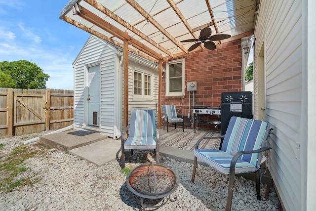 view of patio featuring ceiling fan and a pergola