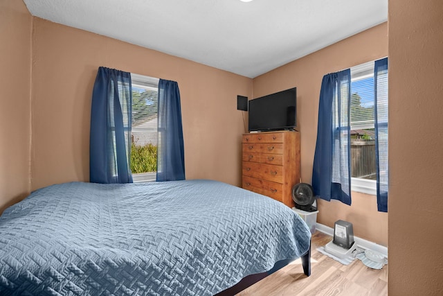 bedroom featuring hardwood / wood-style floors